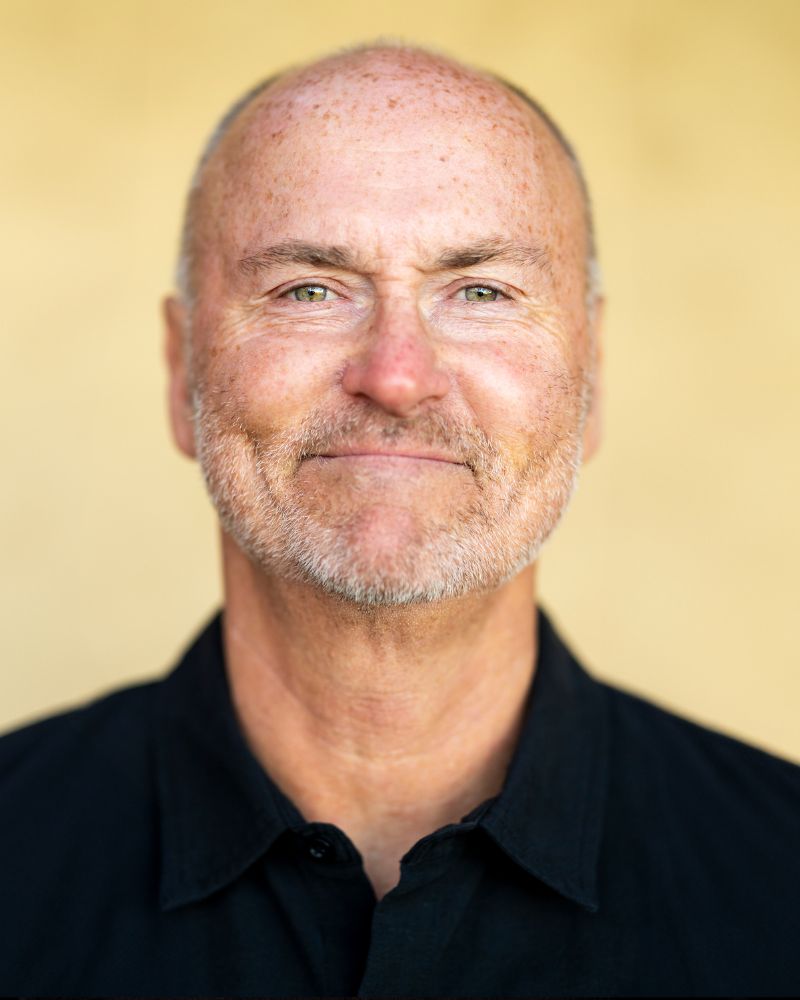 chip conley headshot for the no magic pill podcast yellow background